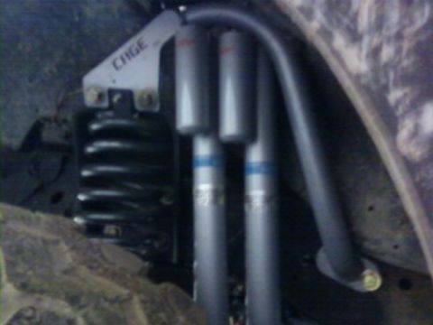 1995 Ford Bronco - Suspension components, including a coil spring and shock absorbers, are visible in this close-up view.