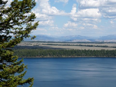 2006 Ford E350 - Expansive view of a lake and mountainous landscape with scattered clouds.