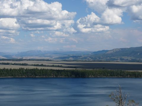 2006 Ford E350 - Expansive landscape view with a large body of water and rolling hills under a partly cloudy sky.