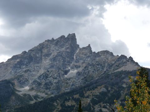 2006 Ford E350 - A dramatic mountain landscape with peaks and a foreboding sky.