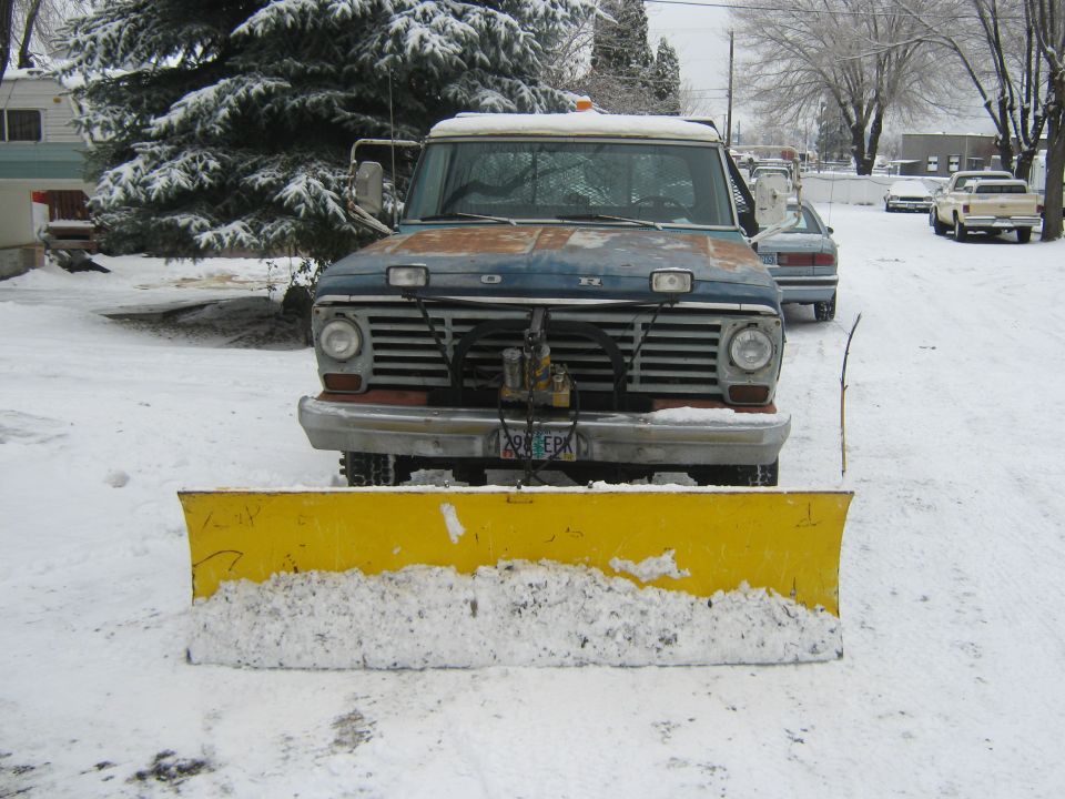 1972 Ford F-250 front view with yellow snow plow