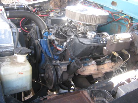 1972 Ford F-250 - The engine bay features a V8 engine with an aftermarket air filter and various hoses and wires.