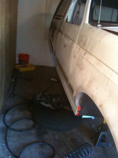 1995 Ford Bronco - This 1995 Ford Bronco is parked in a garage and appears to be undergoing maintenance.