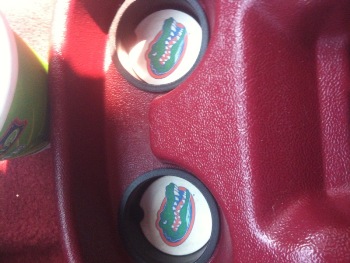 1995 Ford Bronco - Close-up of the interior dashboard showing cup holders with alligator graphics.