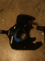 1995 Ford Bronco - A black car part is visible on the floor, its purpose and origin unclear.