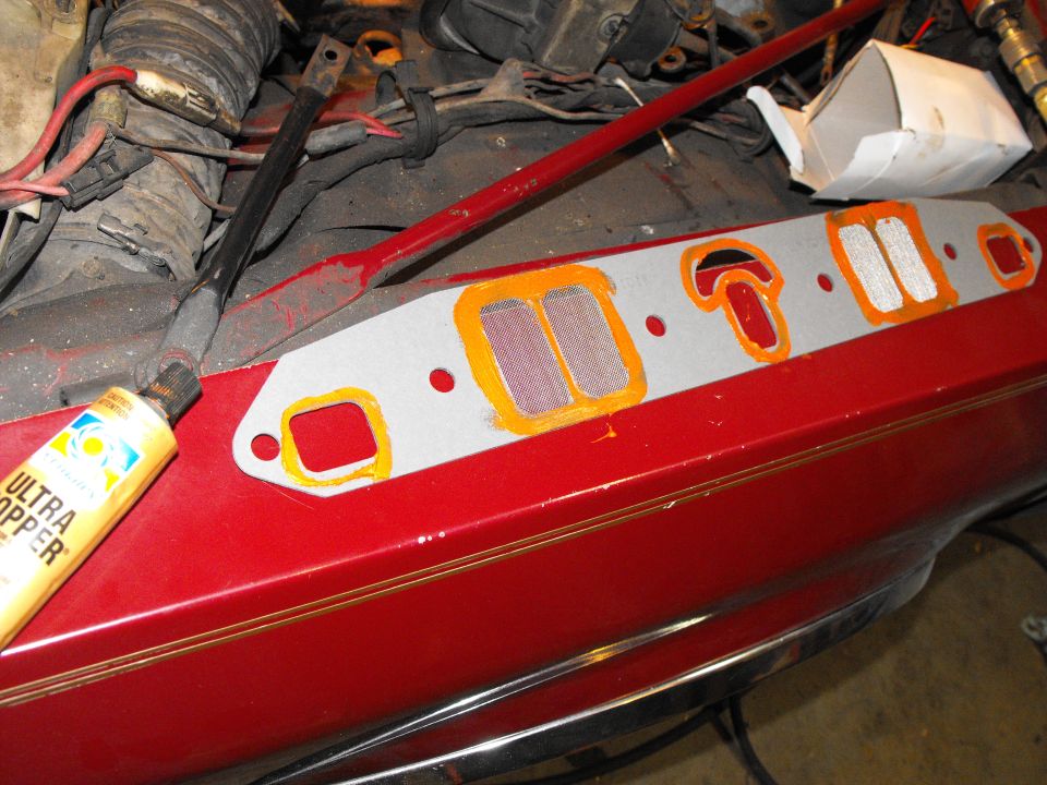 Thin layer of Ultra Copper on both sides of the TorquePlus intake gaskets. Torque them to 45 ft/lbs like normal. Retorque them several times in the first hours of running to prevent leaks, as they are twice as thick as normal.