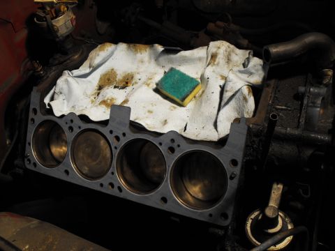 1982 Chrysler New Yorker - Cleaned off the pistons with 3M pads mounted on the 2" air grinder.