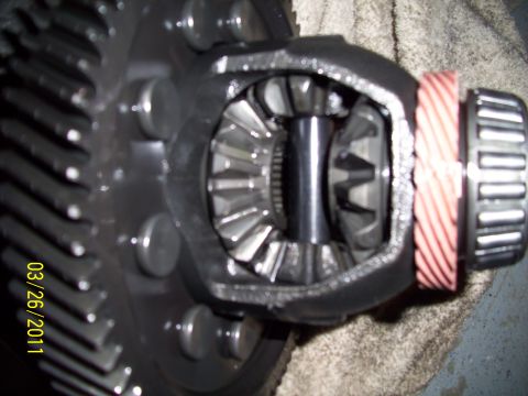 1995 Ford Probe - Differential gears are visible in this close-up shot, showing a red shim and bearing assembly.