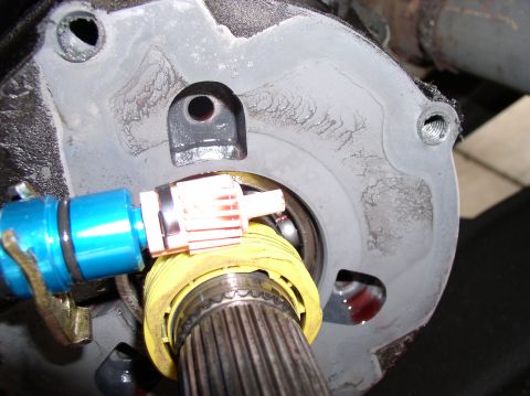 1988 Ford Bronco - Close-up of a vehicle's transfer case component during a rebuild.