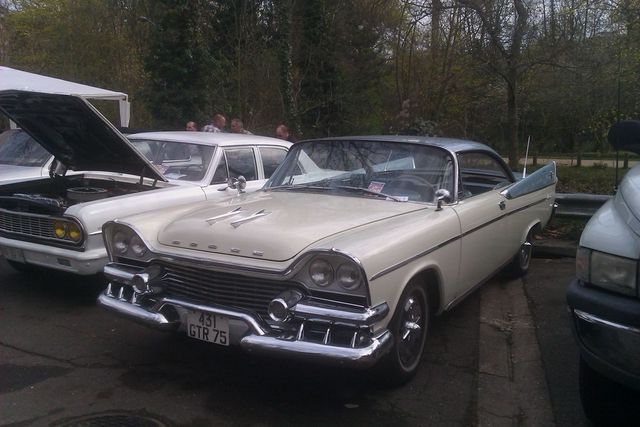 1957 Dodge Custom Royal two-tone coupe with chrome grille and fins. License plate reads 431 GTR 75