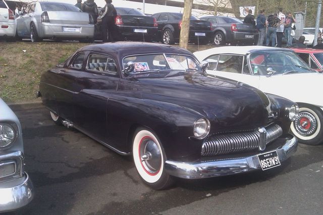 1950 Mercury Eight Coupe with wide whitewall tires and chrome grille