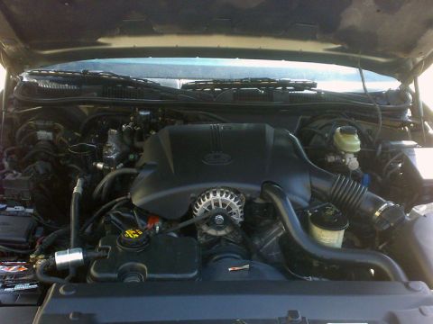 2001 Mercury Grand Marquis - Engine bay components including alternator, air intake, and fluid reservoirs are visible.