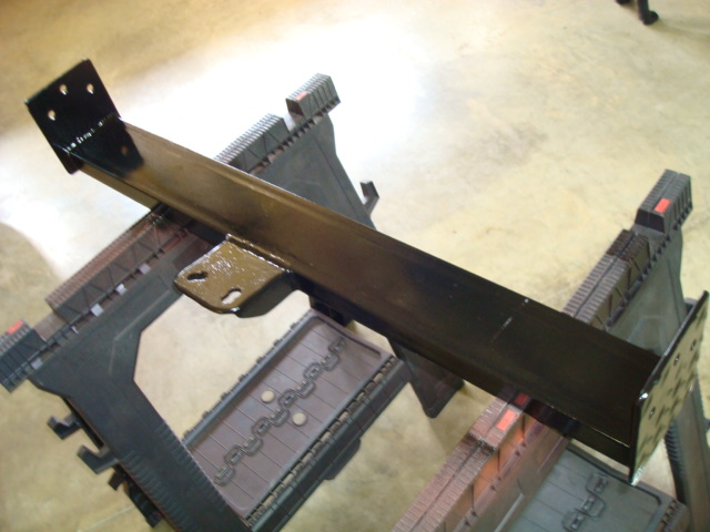 Black metal bracket on sawhorses