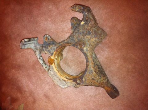 1972 Ford Ranchero - This is a rusty steering knuckle, likely from an older vehicle.