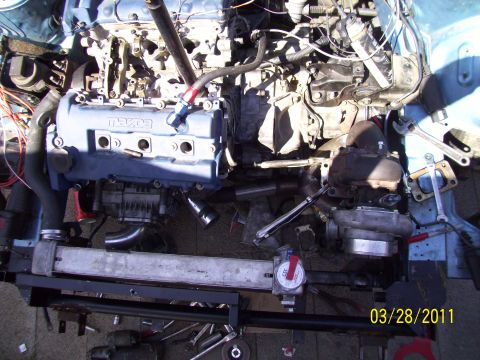 1995 Ford Probe - The engine bay shows a turbocharger and intercooler, with the Mazda engine visible.