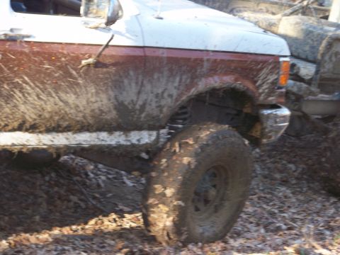 1989 Ford Bronco - This truck is covered in mud, suggesting it has been off-roading.