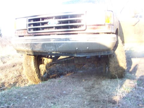 1989 Ford Bronco - This 1989 Ford Bronco is stuck in the mud, showing its front end.