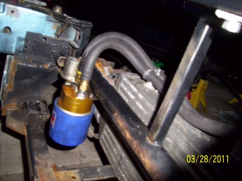 1995 Ford Probe - Custom engine oil cooler and filter assembly with hoses visible near a radiator.