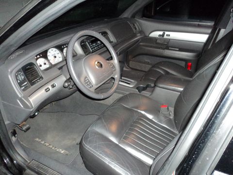 2004 Mercury Grand Marquis - The interior of a 2004 Mercury Grand Marquis is visible, leather seats and the dashboard instrumentation.
