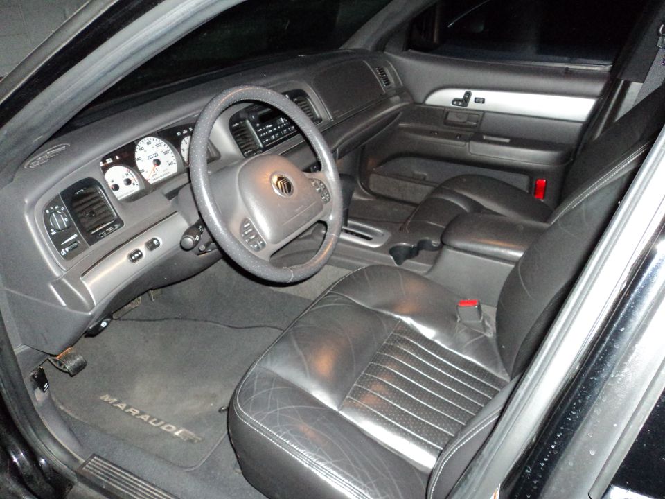 Black leather Mercury interior with white-face gauges and a MARAUDER floor mat