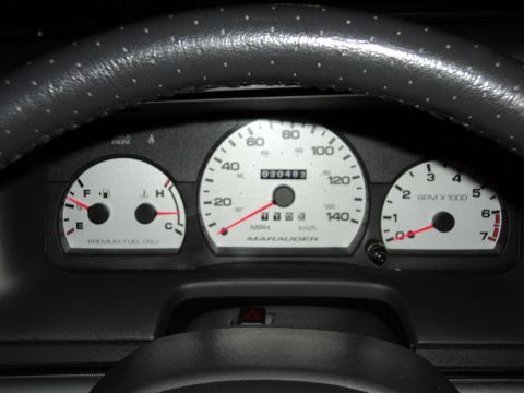 2004 Mercury Grand Marquis - Interior view of the Marauder instrument cluster, displaying mileage and fuel level.