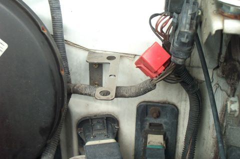 1995 Ford Bronco - Tie-rod adjusting sleeve retainer that I drilled some holes in and bent to make a mounting bracket.