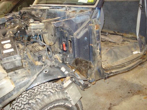 1993 Ford F-150 - Disassembled 1993 Ford F-150 interior and engine bay with exposed components.