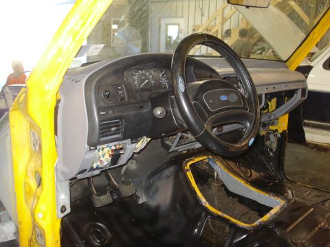 1993 Ford F-150 - Interior view of a 1993 Ford F-150, showing the dashboard, steering wheel, and floor console during restoration.