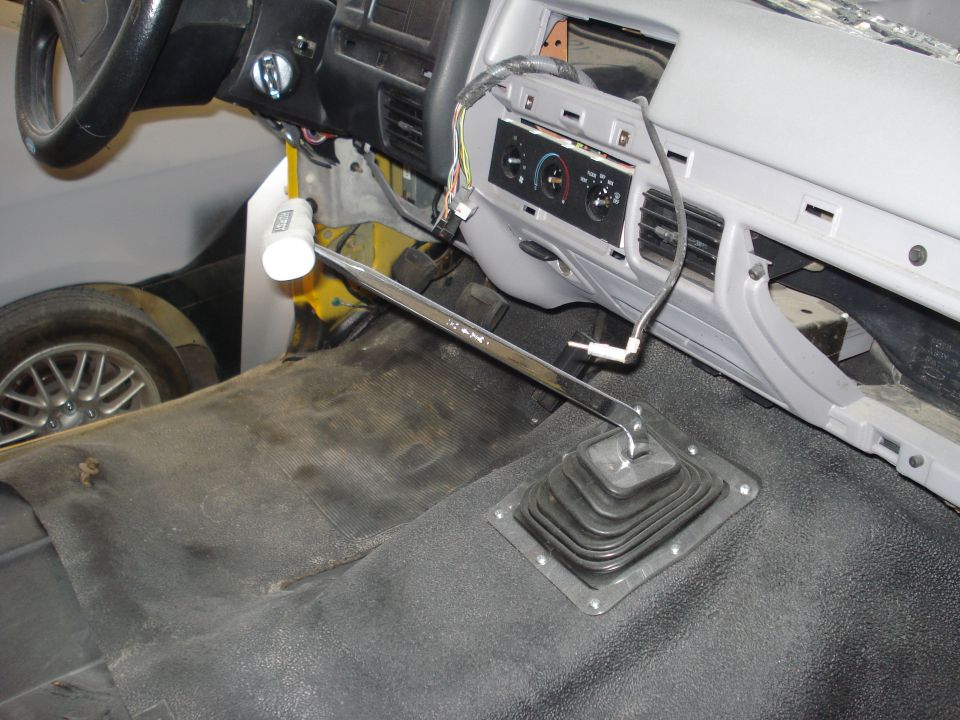 1993 Ford F-150 interior showing dashboard removed, floor shifter, and part of the steering wheel