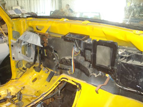1993 Ford F-150 - The interior of a vehicle is shown disassembled, with the dashboard removed and components exposed.