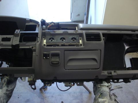 1993 Ford F-150 - The dashboard assembly is shown disassembled, with various components removed and wiring exposed.