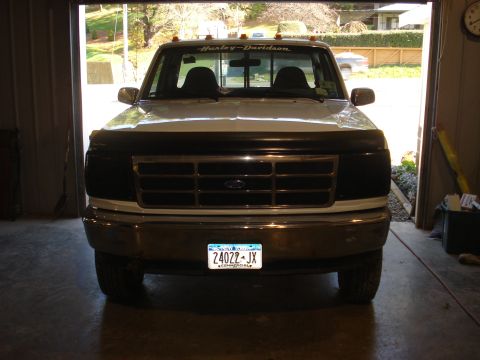 1993 Ford F-150 - Front view of a white Ford F-150 truck parked inside a garage.