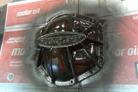 1993 Ford F-150 - A black differential cover, labeled "ROCKCRUSHER", is shown against a background of motor oil packaging.