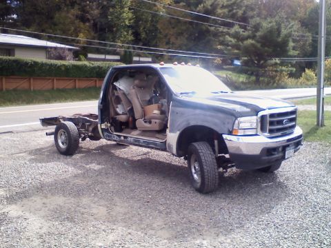 1993 Ford F-150 - This Ford F-Series truck is missing its bed and rear chassis components, showing only the cab and front end.