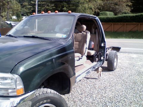 1993 Ford F-150 - This Ford Super Duty truck is missing its bed and appears to be undergoing some form of repair or modification.