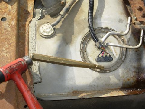 1995 Ford F-150 - After washing & vacuuming, and a little penetrating oil (NONE on the O-ring), the lock ring can come out. The brass drift prevents sparks.…
