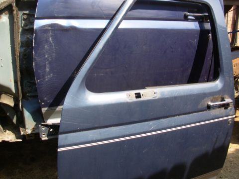 1995 Ford F-150 - This '93 Bronco door is MX (Dark Shadow Blue Metallic), which isn't quite as purple as this truck's LA (Royal Blue Metallic).