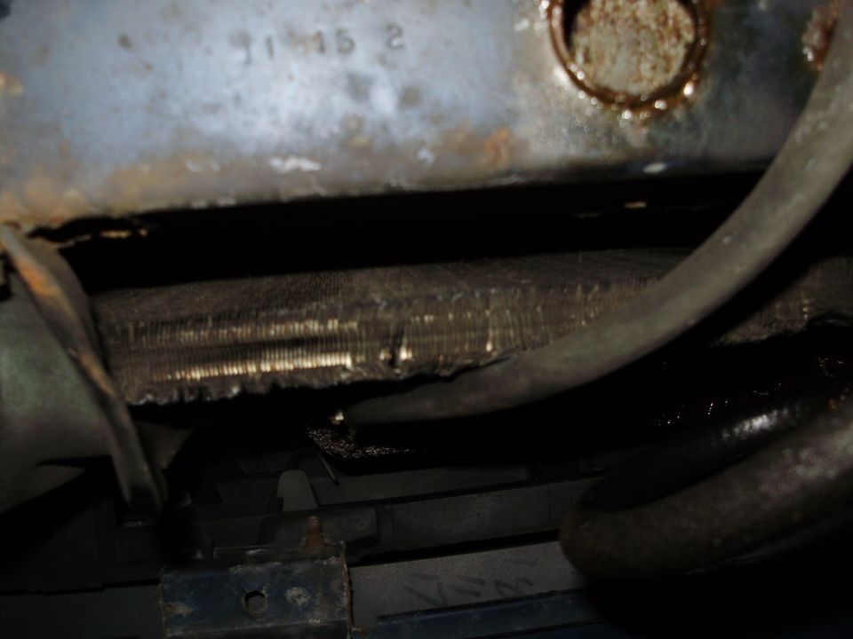 1995 Ford Bronco radiator and hoses, showing some rust and wear