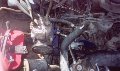 1987 Ford Bronco - shot of k. lawyer bracket, note batter had to be turned and tray had to be trimmed
