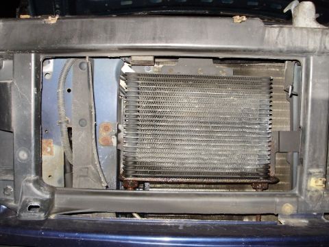 1995 Ford Bronco - Close-up of the transmission cooler on a 1995 Ford Bronco, revealing its condition and location.