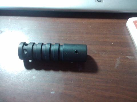 1989 Ford Bronco - This is a black metal part with ridges and holes, likely a component from a larger assembly.