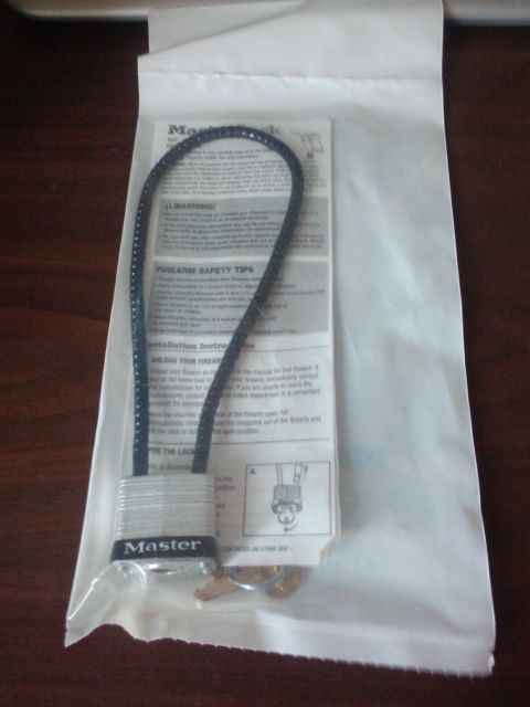 1989 Ford Bronco - Master Lock and instructions are packaged together, with firearm safety tips visible.