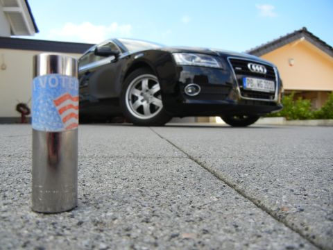 2010 Audi A4 - A black Audi A4 is parked in a driveway, with a voter sticker on a socket in the foreground.
