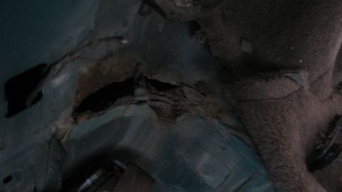 1992 Ford Bronco - Significant rust damage is visible on the vehicle's floor pan.