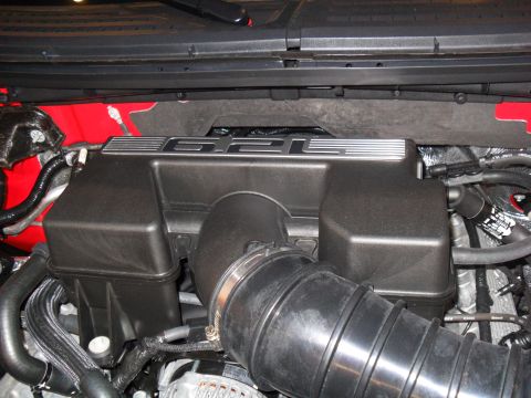 2011 Ford F-150 - Engine intake manifold with 6.2L badge and air intake hose.