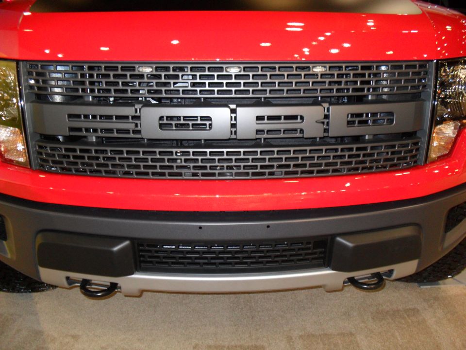 Red Ford Raptor front grille with FORD lettering and round fog lamps