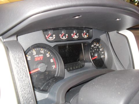 2011 Ford F-150 - Interior view of a 2011 Ford F-150 SVT Raptor dashboard, showing gauges and the center display.