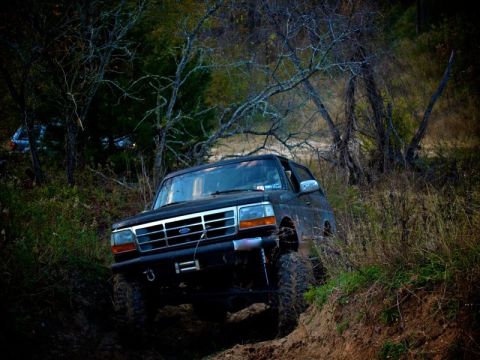 1995 Ford Bronco - This 1995 Ford Bronco is navigating a challenging off-road trail.