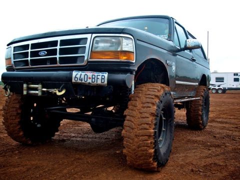 1995 Ford Bronco - This lifted Ford Bronco is ready for off-road adventure with its aggressive tires and winch.