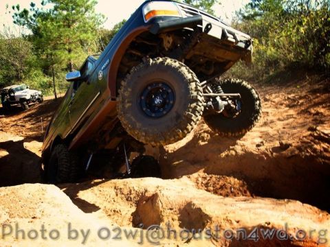 1995 Ford Bronco - A modified Ford Bronco navigates a challenging off-road course.